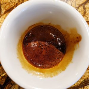 High angle view of coffee in cup on table
