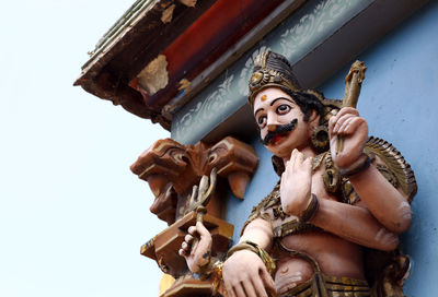 Low angle view of statue on cross