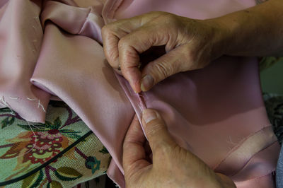Midsection of woman holding hands