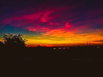 Scenic view of dramatic sky at sunset