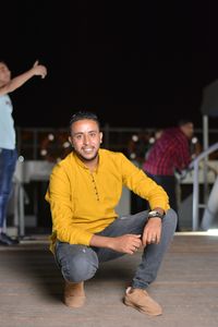 Portrait of young man sitting outdoors