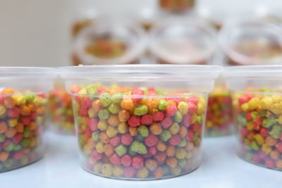 Close-up of multi colored candies in glass jar