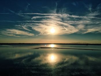 Scenic view of calm sea at sunset