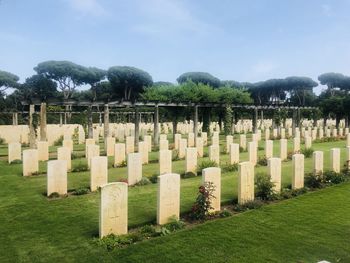 Row of cemetery against sky