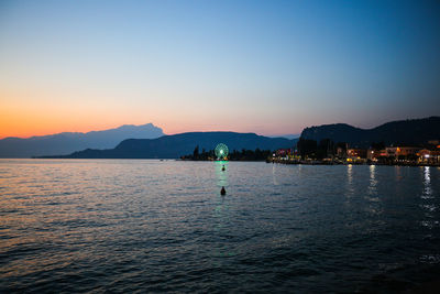 Scenic view of sea against clear sky during sunset