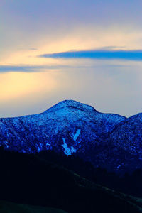 Scenic view of mountain against sky during sunset