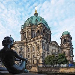 Low angle view of statue against sky