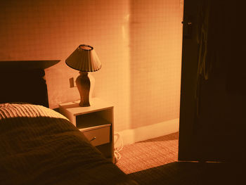 Shadow of lamp on bed at home