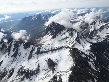 Aerial view of snowcapped mountains against sky