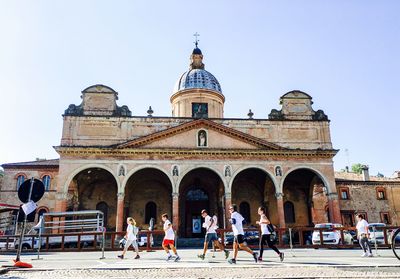 People in front of building