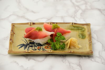 High angle view of fruits in basket on table