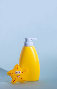 Close-up of bottle against blue background