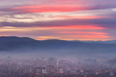 Cityscape against sky during sunset