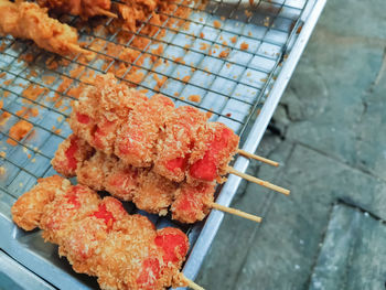 High angle view of meat on barbecue grill