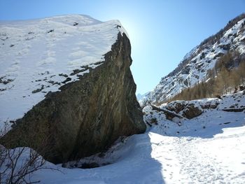 Scenic view of snow covered mountains against sky