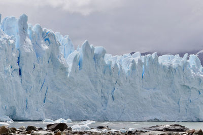 Scenic view of glacier against sky