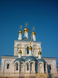 Low angle view of building against blue sky