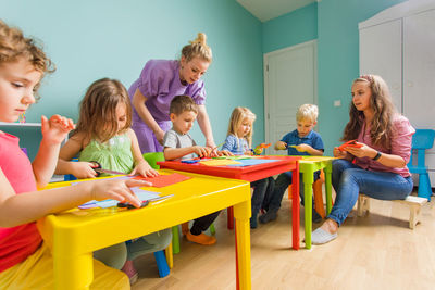 Teacher with students in classroom