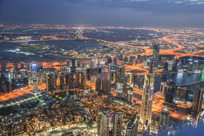 High angle view of illuminated buildings in city at night