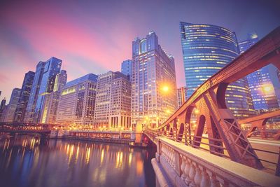 Illuminated buildings in city at night