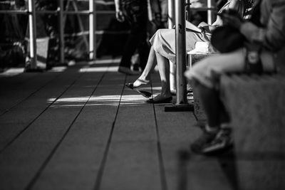 Low section of people on floorboard