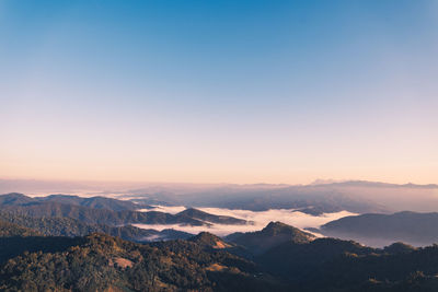 Scenic view of mountains against sky during sunset