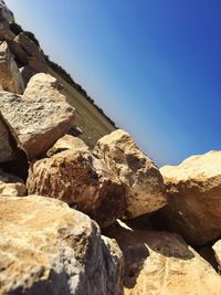 Rock formations against clear blue sky