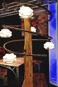 Low angle view of illuminated lamp at night