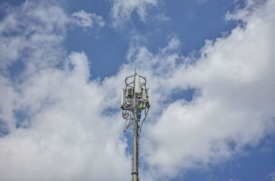 Low angle view of floodlight against sky