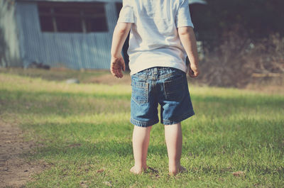 Man standing on grassy field