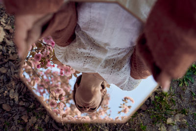 High angle view of person holding umbrella