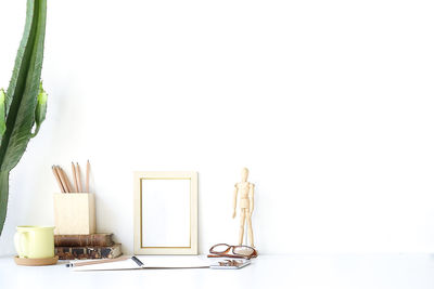 Close-up of objects on table against white background