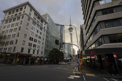 City street and buildings against sky