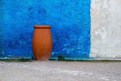 Close-up of blue light against building wall