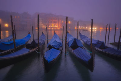 Gondolas moored at sea during foggy weather 