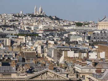 Cityscape with sacre coeur against clear sky