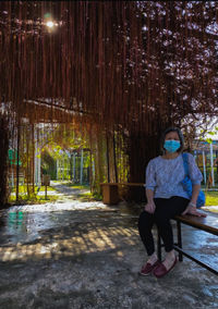 Rear view of woman standing in park