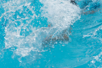 Close-up of water splashing in swimming pool