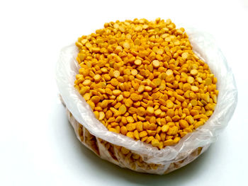 High angle view of rice in bowl against white background