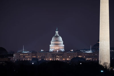 Illuminated buildings in city at night