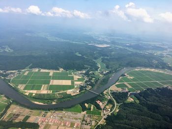 Aerial view of agricultural landscape against sky