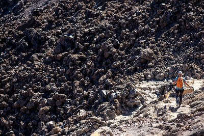 Girl running down a rock