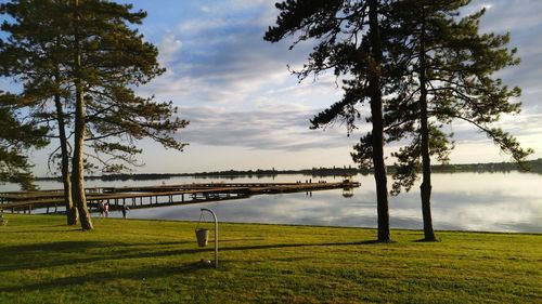 Scenic view of lake against cloudy sky