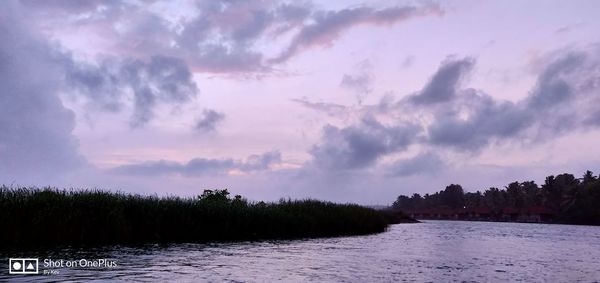 Panoramic view of lake against sky at sunset