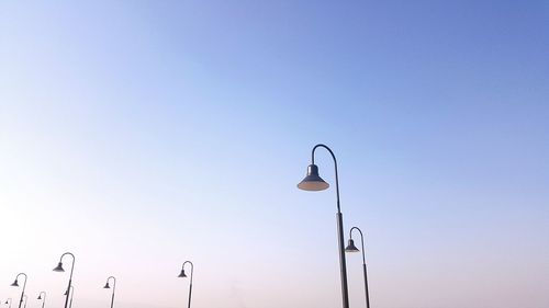 Low angle view of street light against clear blue sky