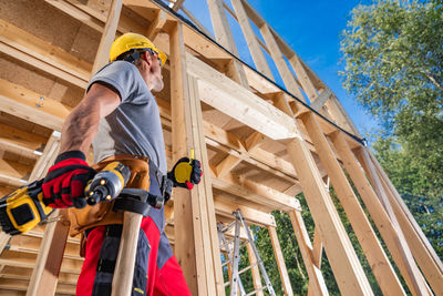 Low angle view of man working in workshop