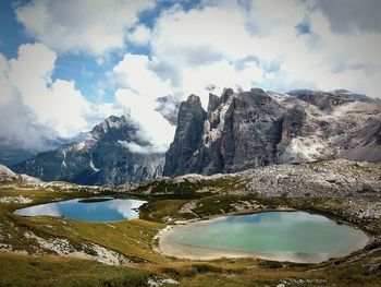 Scenic view of mountains against cloudy sky