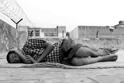 Boy sleeping peacefully on the roof top