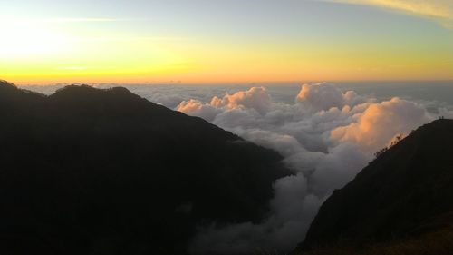 Scenic view of mountains against sky during sunset