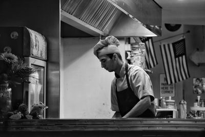 Young man standing at home